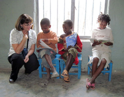 Dr. Laurie Curtis with children in Ethiopia photo